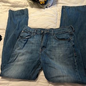 medium wash mid rise Calvin Klein jeans